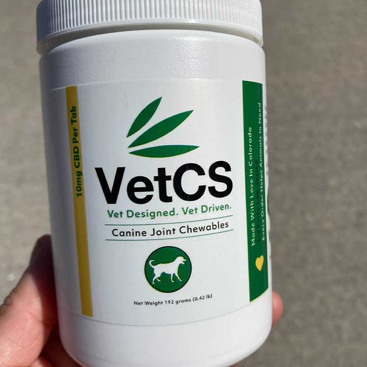 CBD Joint Chewables for dogs container size in hand reference.